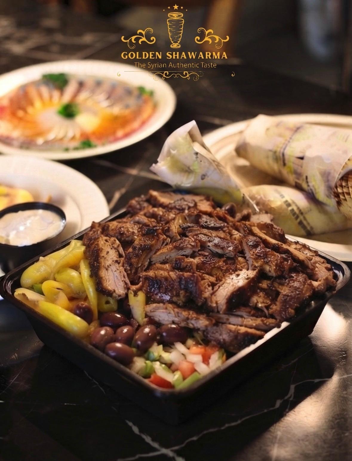 Beef shawarma platter with pickles, olives and garlic sauce at Golden Shawarma in Richardson, TX