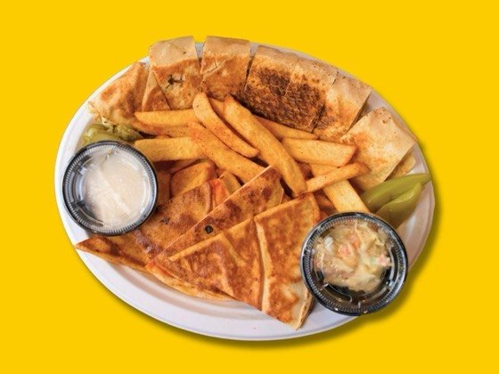 Chicken shawarma plate Arabic style with fries, pickles and sauce