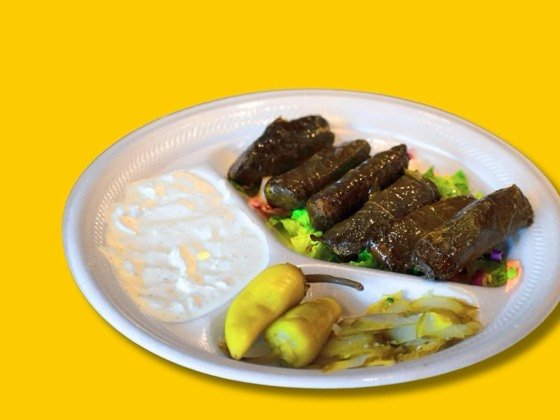 Six stuffed grape leaves filled with rice and herbs