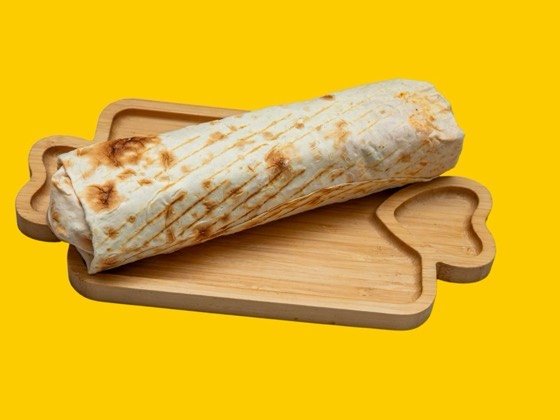 Chicken shawarma wrapped in thin saj flatbread