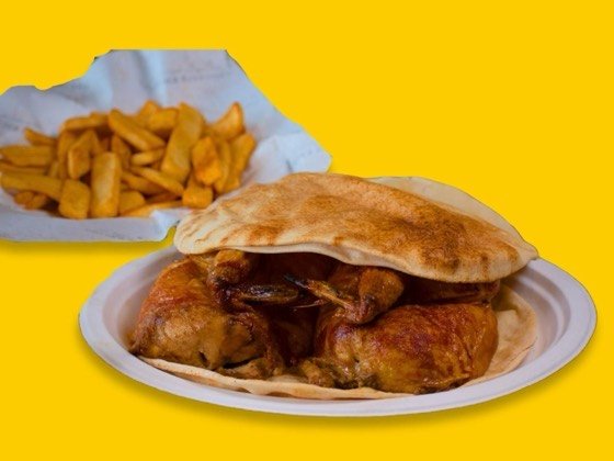 Whole rotisserie chicken with pickles, sauce and bread