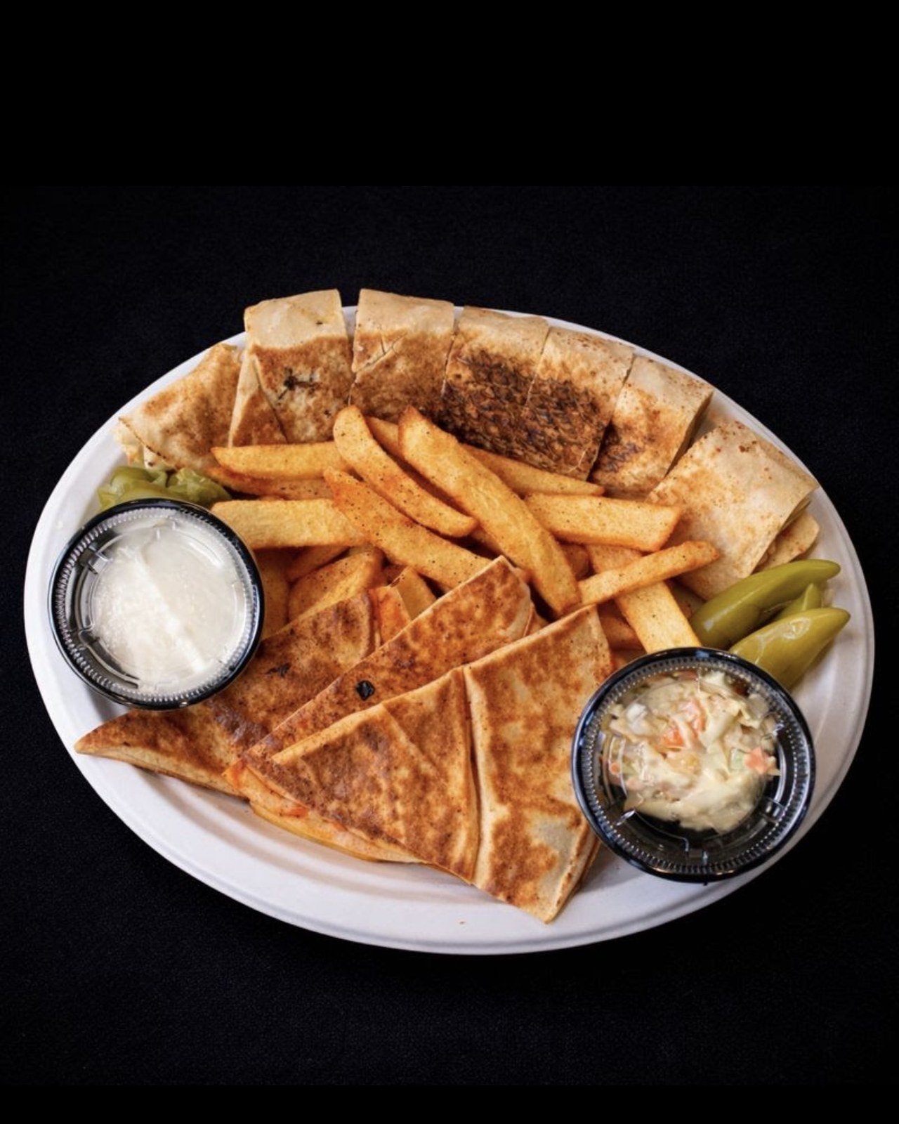 Shawarma saj platter with golden fries, garlic sauce and pickles