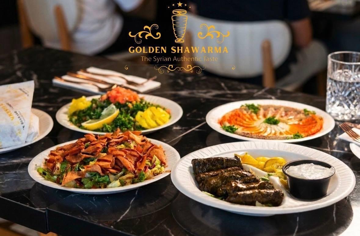 Mezze spread with hummus, tabbouleh, grape leaves and shawarma salad