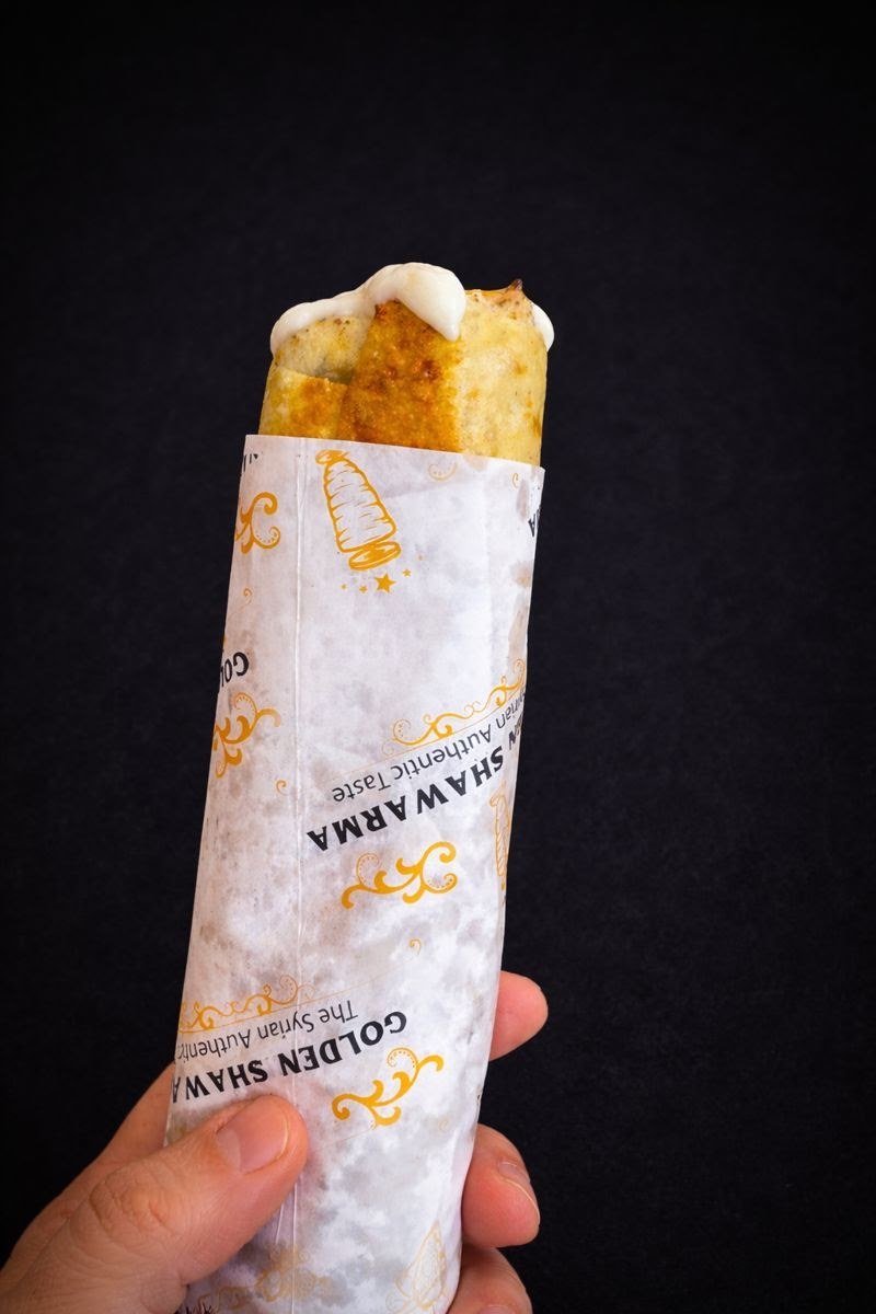 Chicken shawarma wrap in Golden Shawarma paper, ready to eat